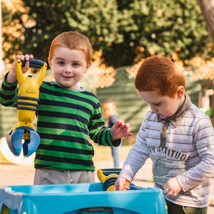 Children enjoying the outdoor equipment at Little Cedars nursery, Streatham.