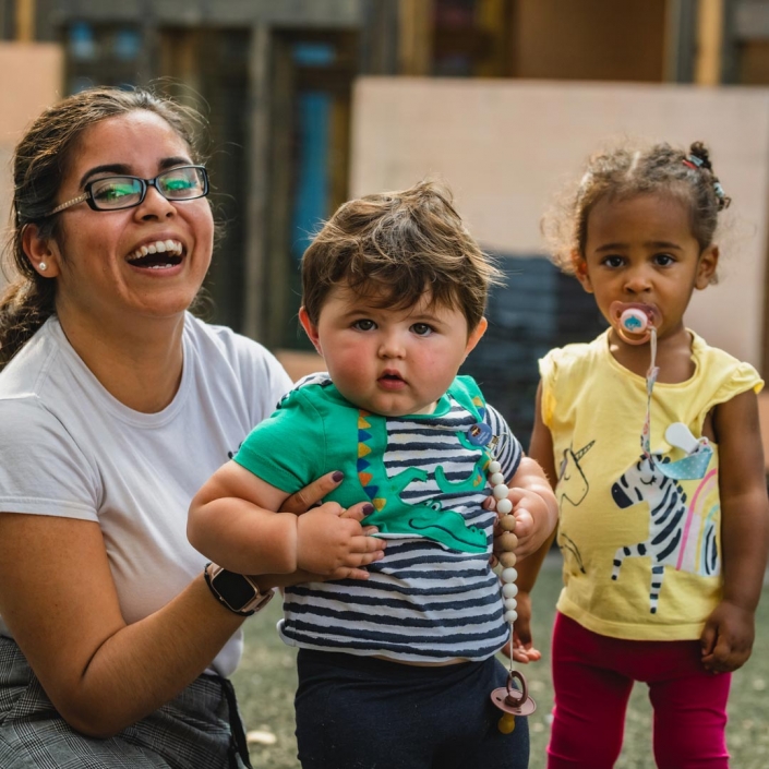 A helping hand from a childcare professional at Little Cedars Day Nursery.