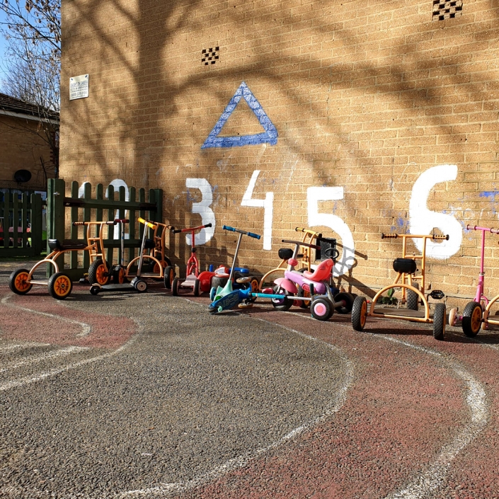 Some of the buggies, scooters and tricycles in the outdoor play areas.