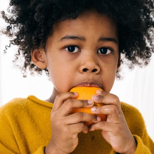 A child eating fruit
