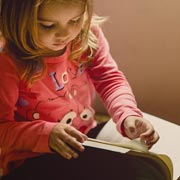 Crossing the midline refers to a person reaching across their body, from one side to the opposite side, in order to complete a task.