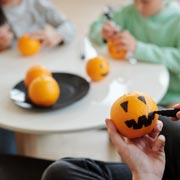 The smallest of children can decorate oranges or yellow/orange bell peppers, so there's no need for dangerous carving.