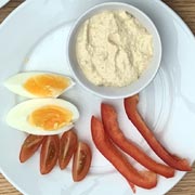 Houmous dip, sliced egg, pepper fingers and tomato, suitably diced.