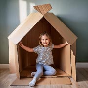 A large cardboard box can become a rocket, a car, or a house with just a little imagination.