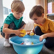 Fill a washing-up bowl with water and let children guess whether different objects will sink or float.