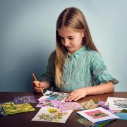 Give your child a mix of stickers, old magazines, and child-safe glue sticks to create their own collage artwork.