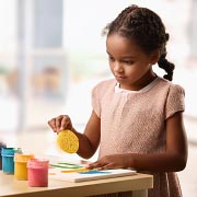 Swap traditional paintbrushes for unusual tools like sponges, cotton pads, or cut vegetables.